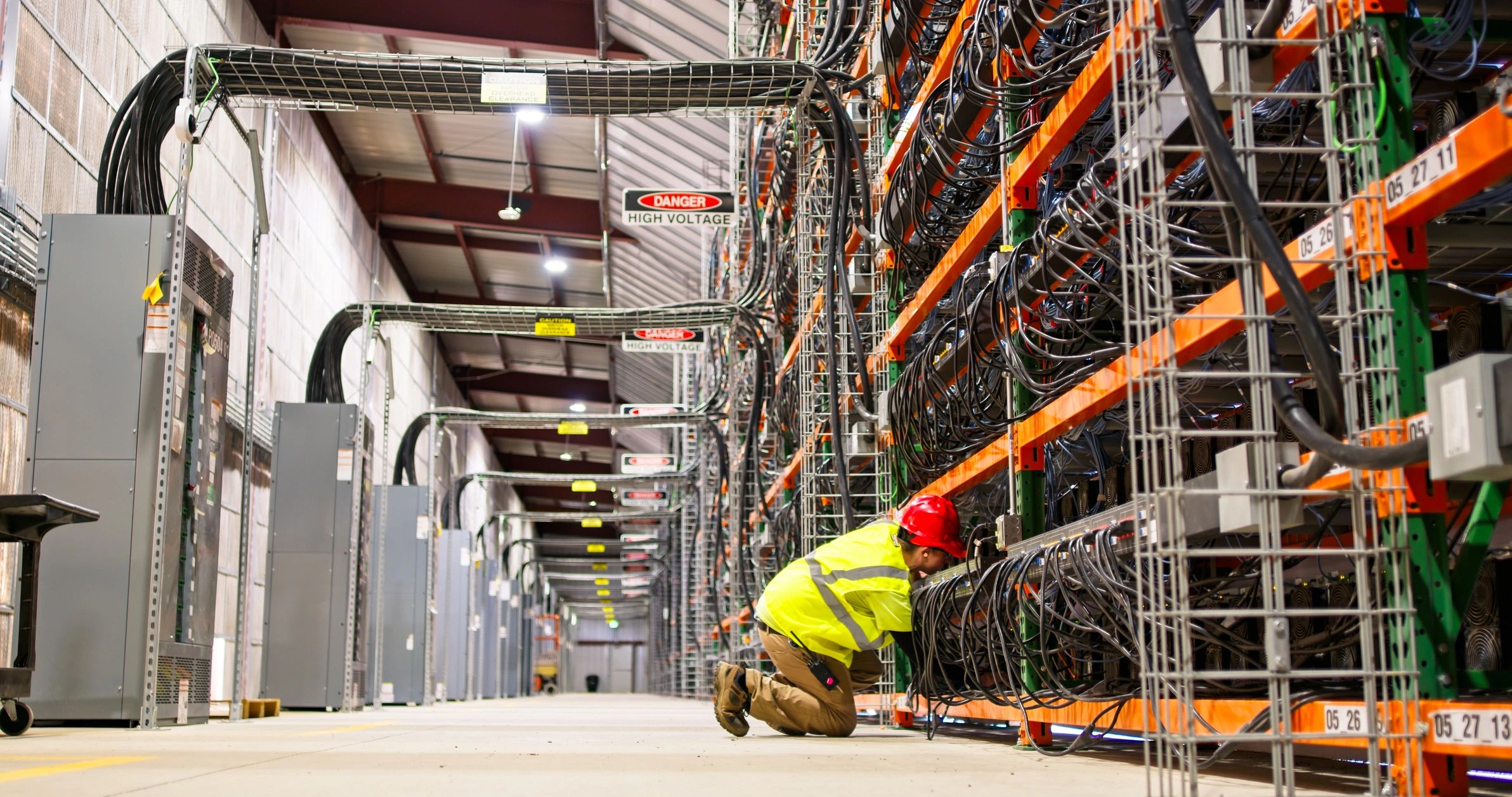Technician working on server racks in a data centre