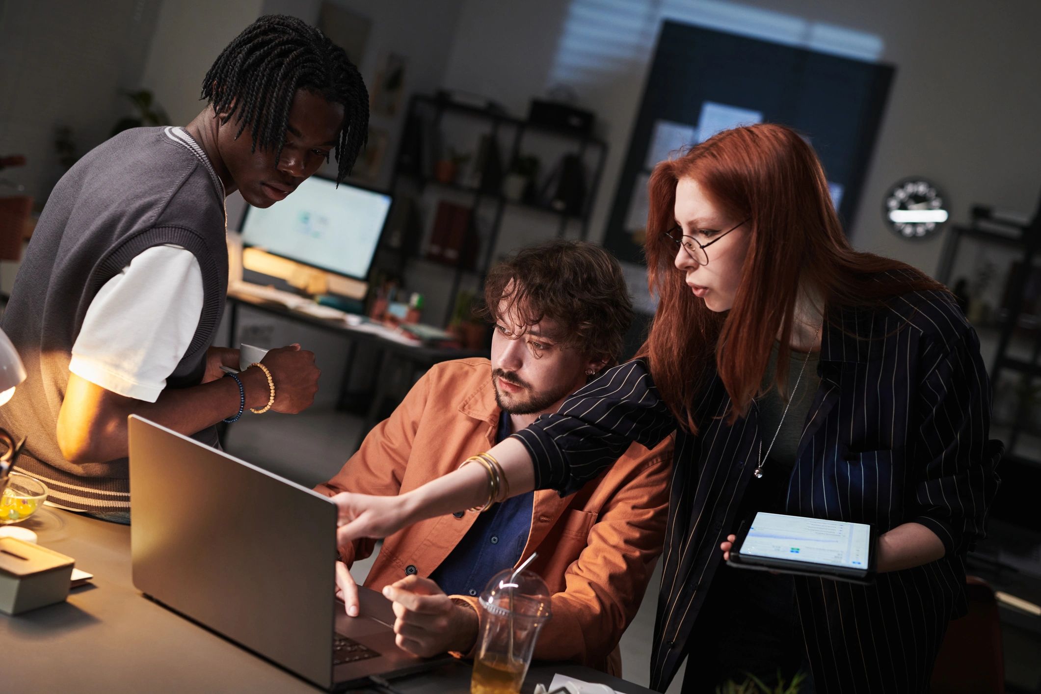 Colleagues reviewing technology information on a laptop
