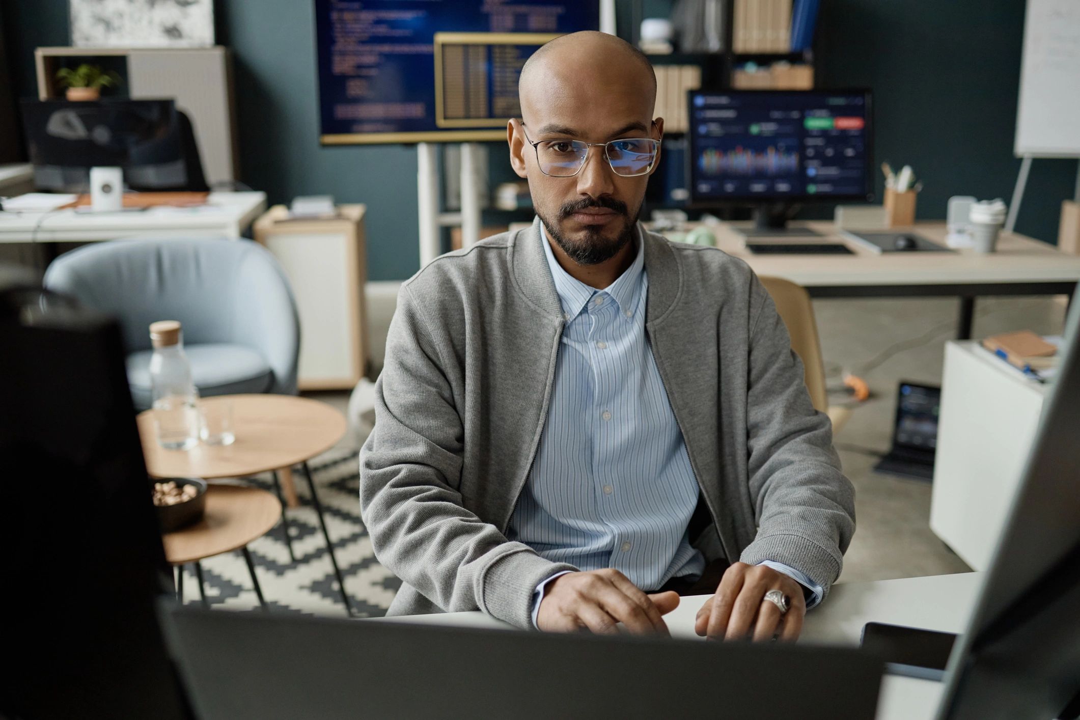 IT professional reviewing systems monitoring dashboards